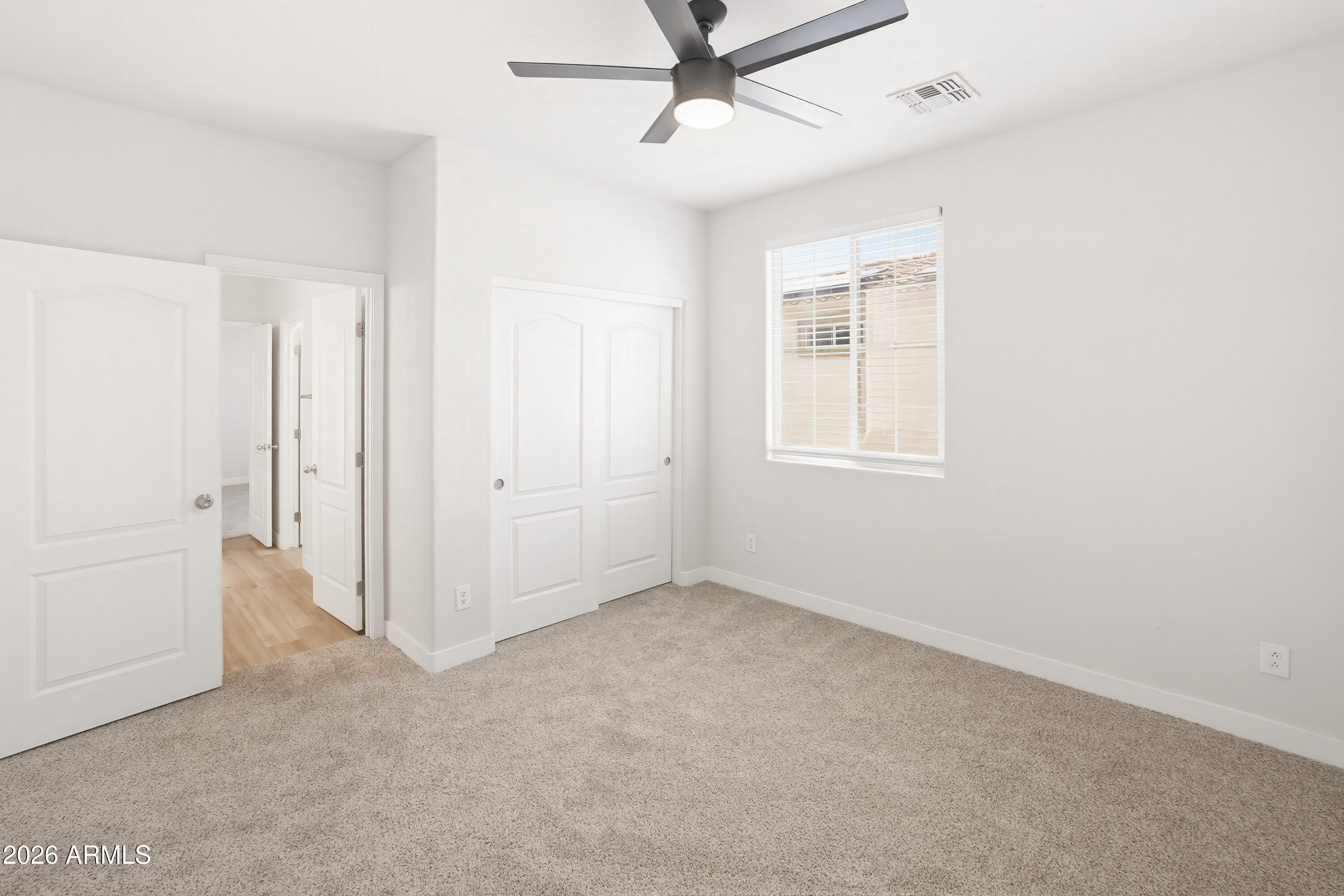17328 West Bajada Road Surprise, AZ 85387 - Photo 25 of 40 an empty room with windows and closet
