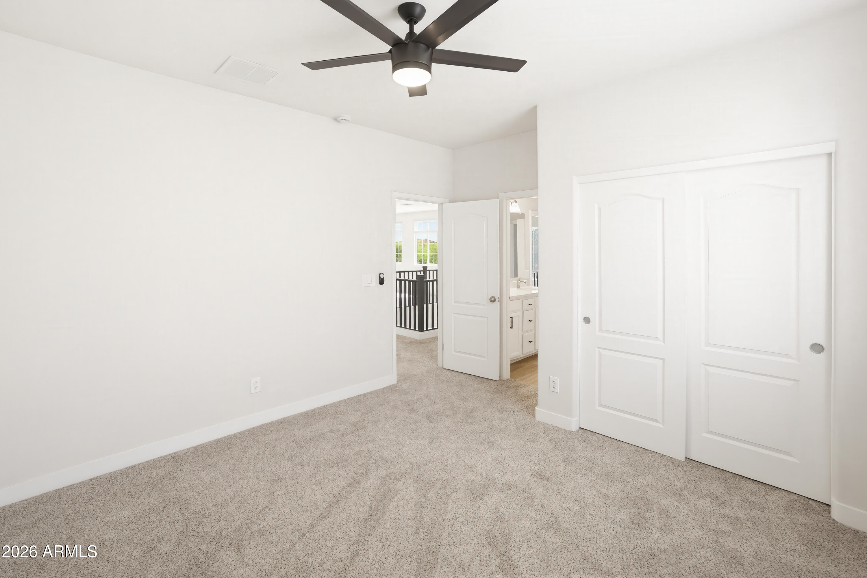 17328 West Bajada Road Surprise, AZ 85387 - Photo 29 of 40 an empty room with a ceiling fan and entryway