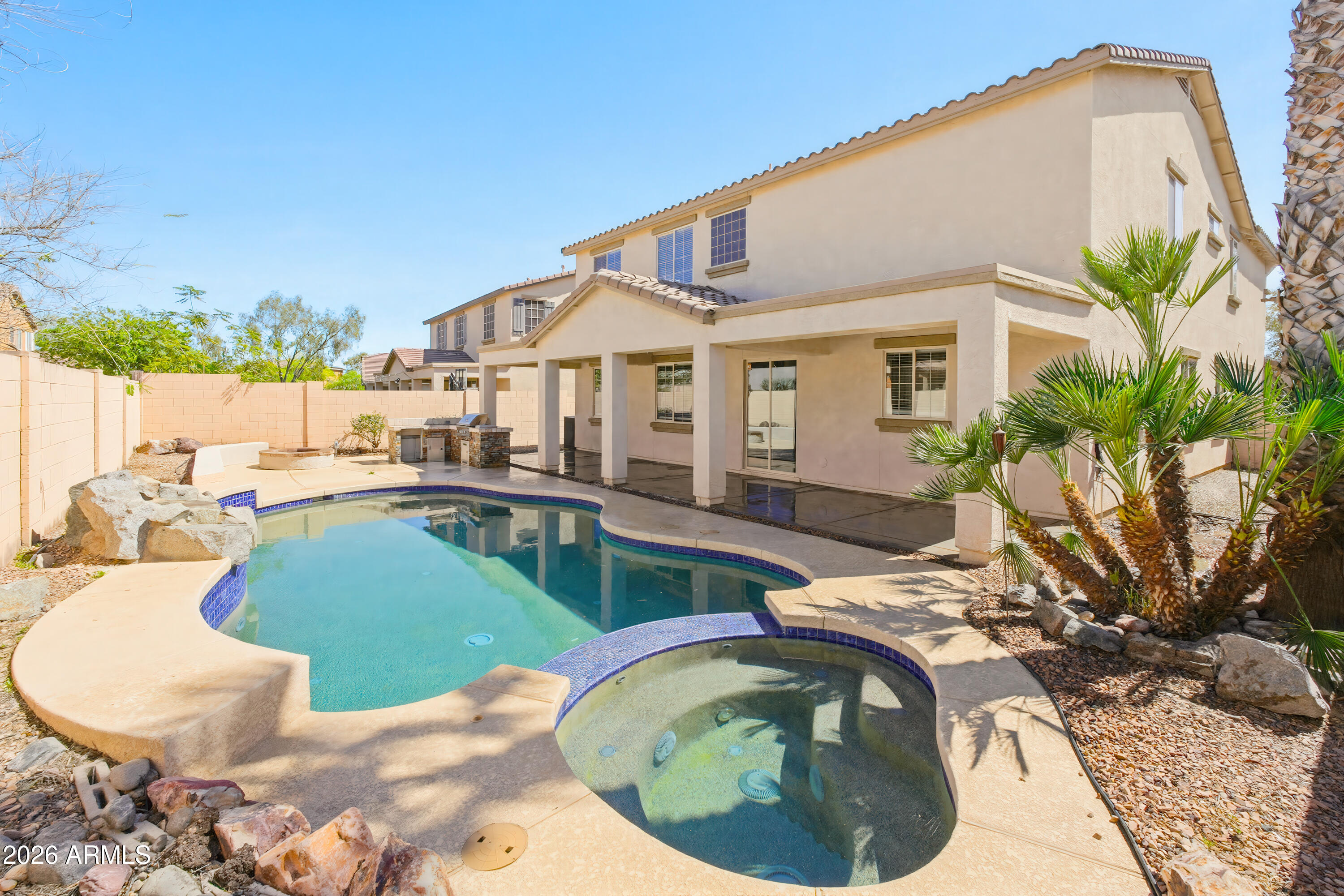 17328 West Bajada Road Surprise, AZ 85387 - Photo 3 of 40 a view of a house with backyard swimming pool and sitting area
