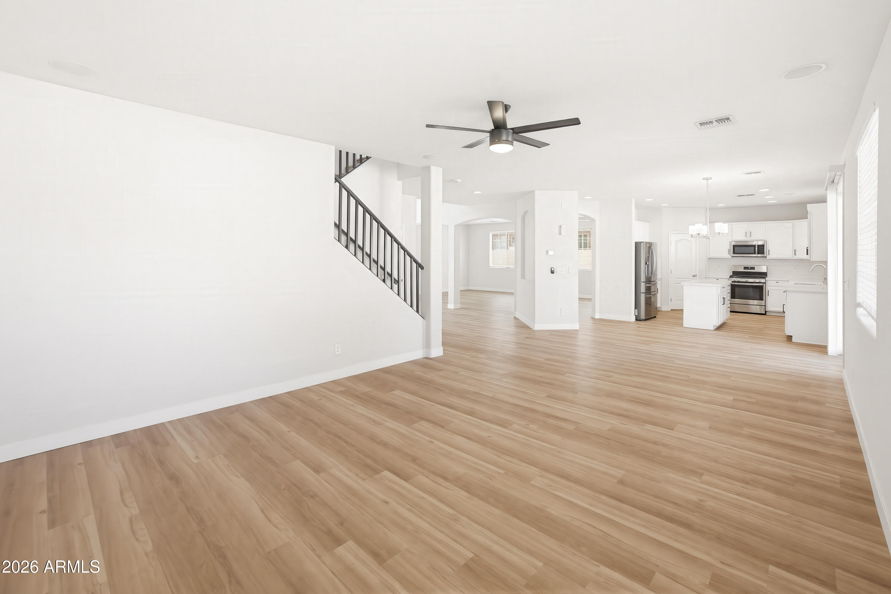 17328 West Bajada Road Surprise, AZ 85387 - Photo 10 of 40 a view of a hallway with wooden floor