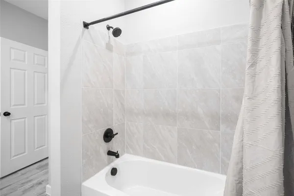 a bathroom with a shower curtain