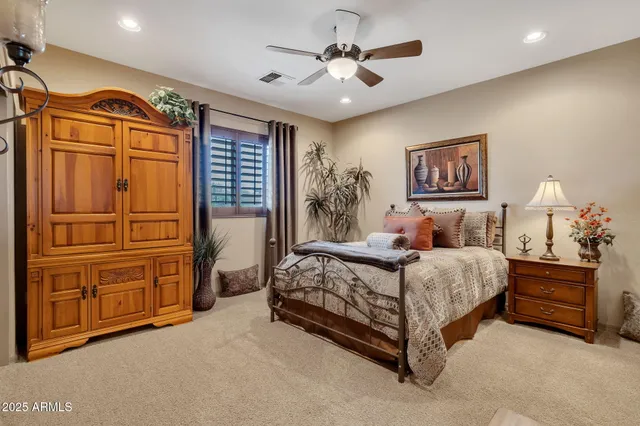 a bed room with a bed and dresser