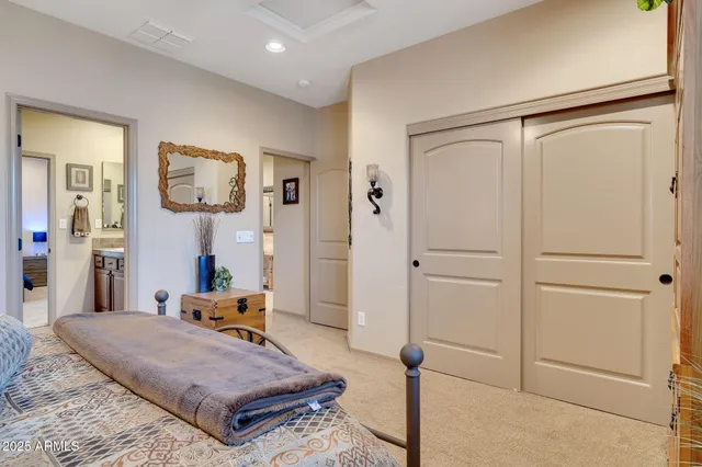 a bed room with a bed and mirror