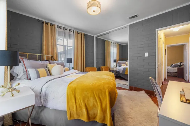 a bed room with a bed and a lamp