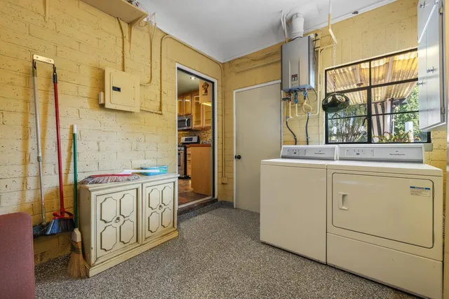 a kitchen with cabinets appliances