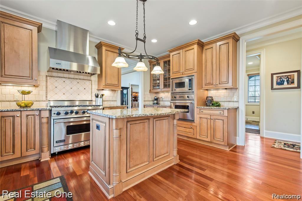 7500 Maple Ridge Drive Clarkston, MI 48346 - Photo 26 of 75 Let's head to the kitchen... aaaahhhhhhh!! Custom, glazed cabinetry with all the extra accented bells and whistles... and island includes a snackbar (currently no stools but room for two)