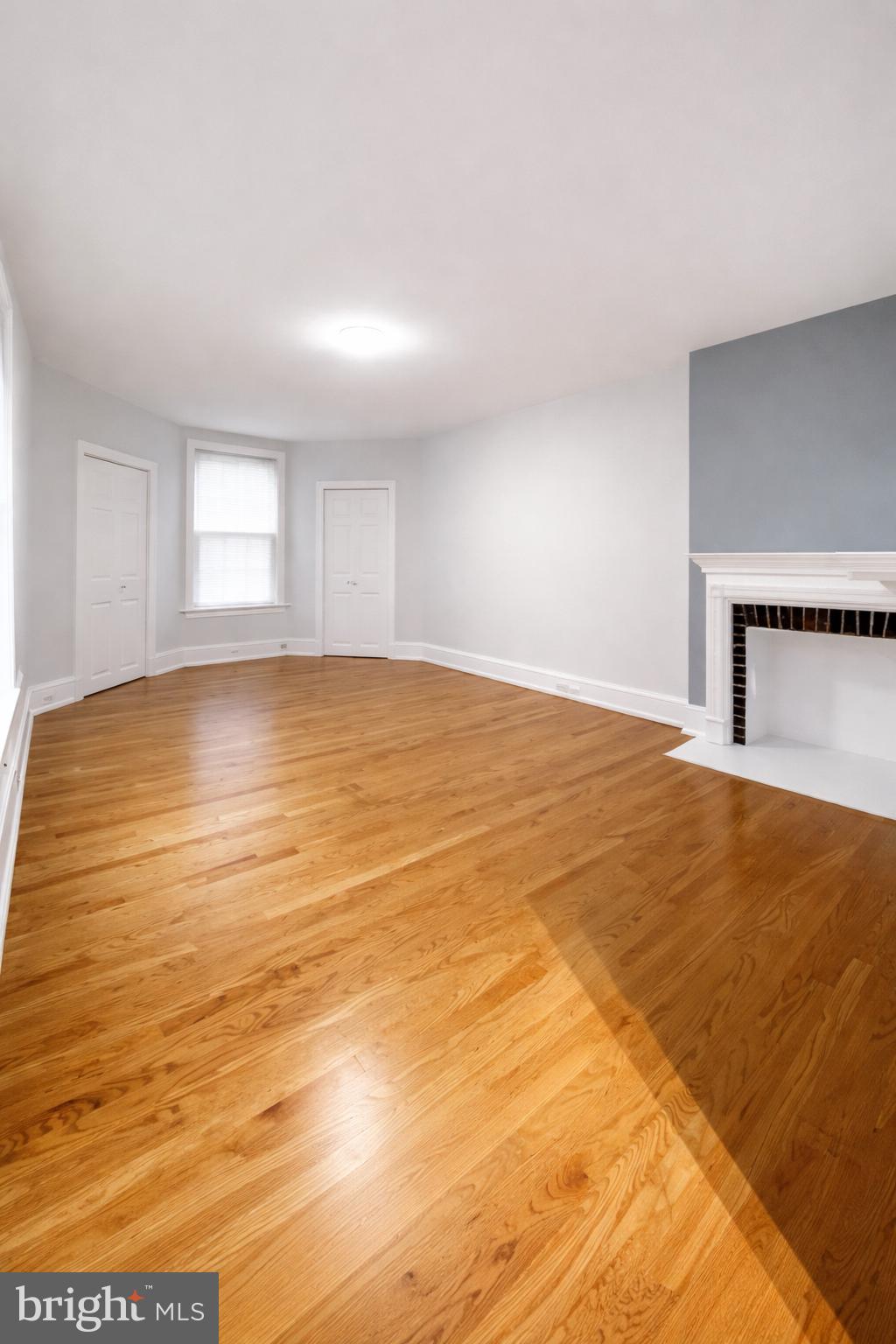 1701-03 Spruce Street, Unit 3R Philadelphia, PA 19103 - Photo 3 of 6 a view of empty room with wooden floor