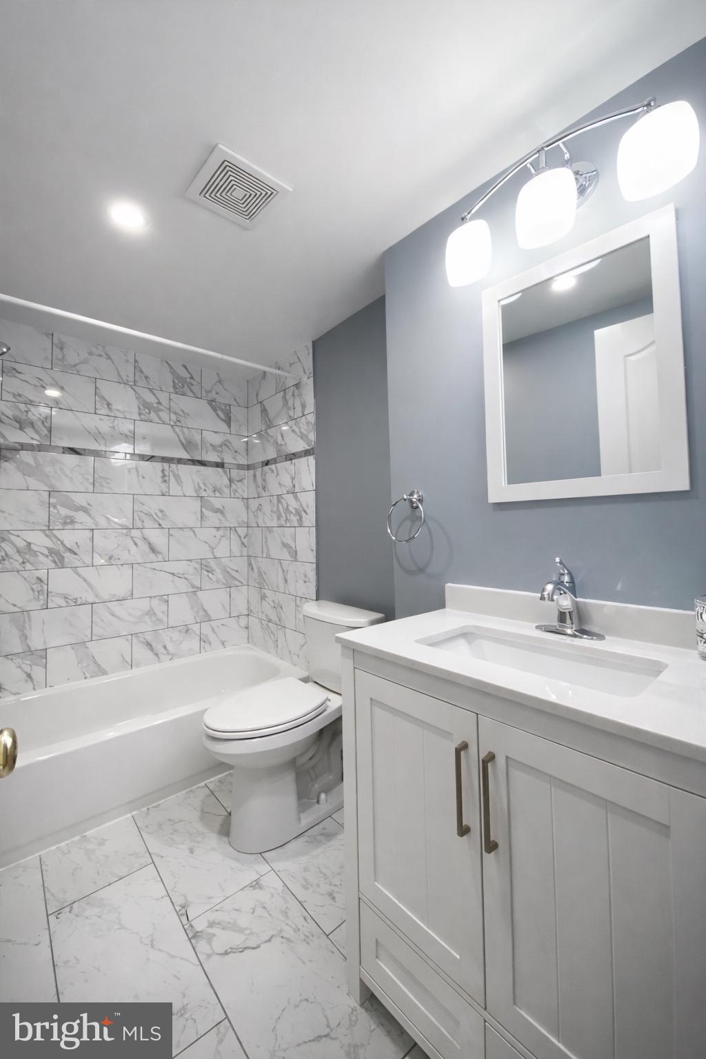 1701-03 Spruce Street, Unit 3R Philadelphia, PA 19103 - Photo 6 of 6 a bathroom with a sink a toilet and shower