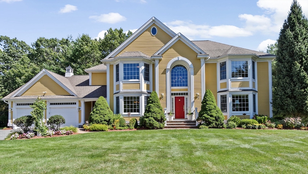 75 Thistle Road North Andover, MA 01845 - Photo 1 of 42 a front view of a house with a yard and porch