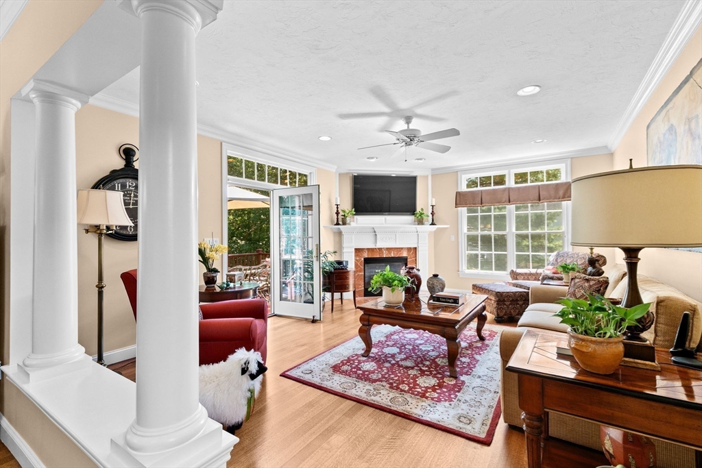 75 Thistle Road North Andover, MA 01845 - Photo 13 of 42 a living room with furniture fireplace and a large window