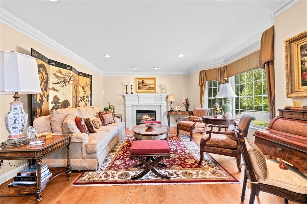 75 Thistle Road North Andover, MA 01845 - Photo 19 of 42 a living room with furniture fireplace and a large window