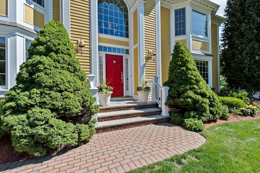 75 Thistle Road North Andover, MA 01845 - Photo 2 of 42 a view of a house with potted plants and a fountain
