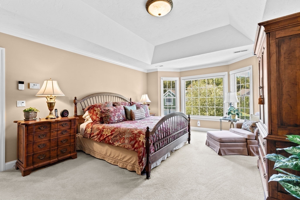 75 Thistle Road North Andover, MA 01845 - Photo 24 of 42 a bedroom with a bed and a couch