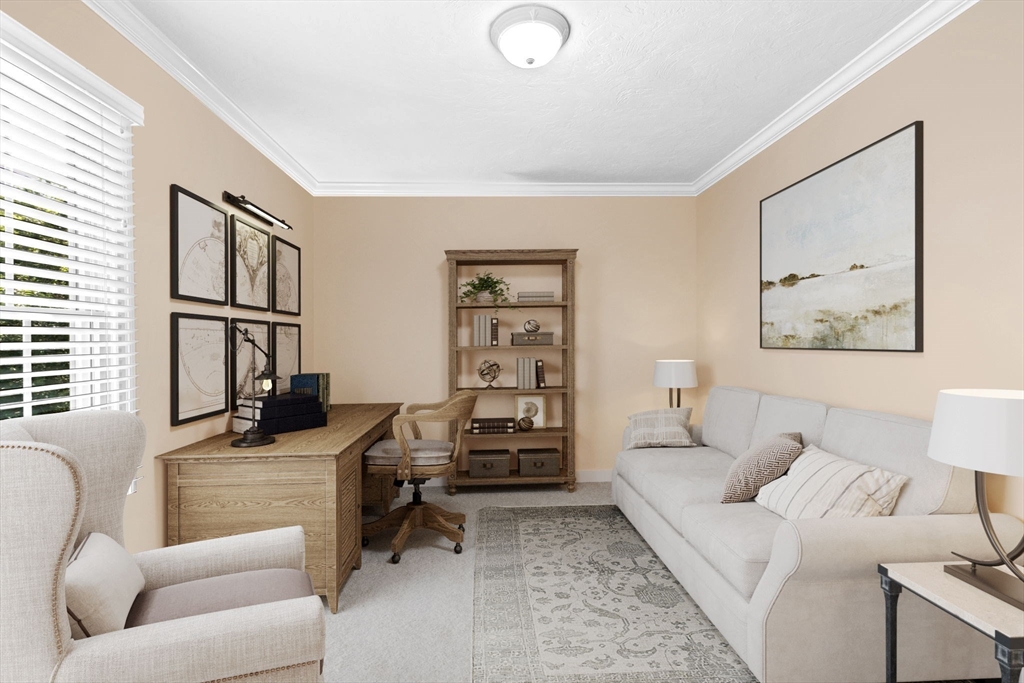 75 Thistle Road North Andover, MA 01845 - Photo 34 of 42 a living room with furniture and a flat screen tv with wooden floor
