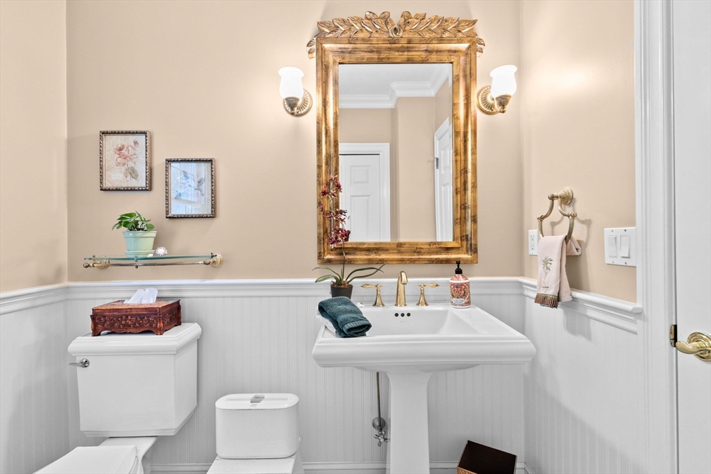 75 Thistle Road North Andover, MA 01845 - Photo 37 of 42 a bathroom with a toilet sink and mirror