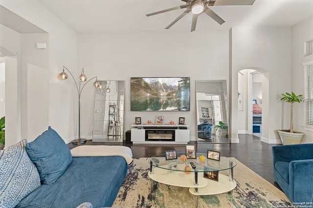 a living room with furniture and a large window