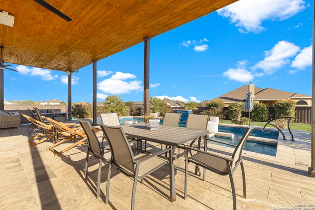 a view of a terrace with furniture and garden