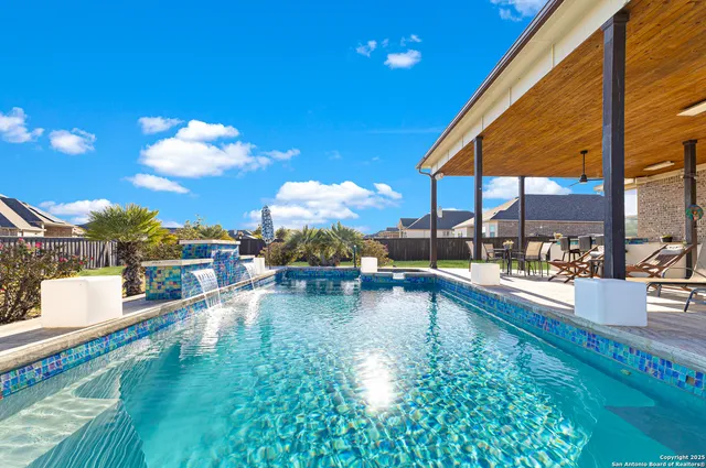 a view of a swimming pool with a patio