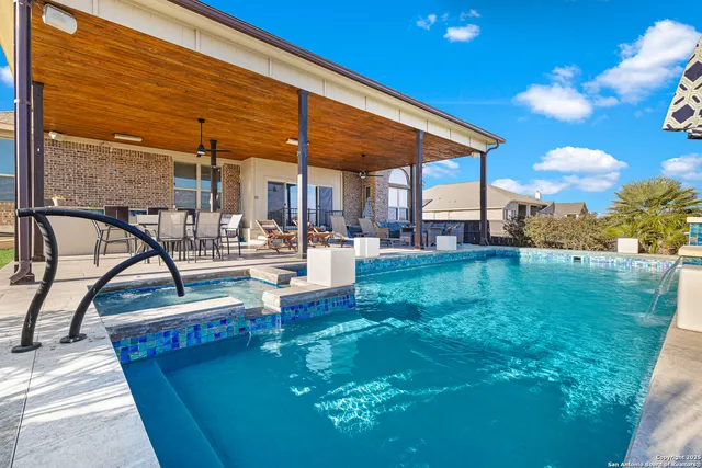 a view of a swimming pool with a patio