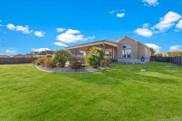 a view of a house with a big yard
