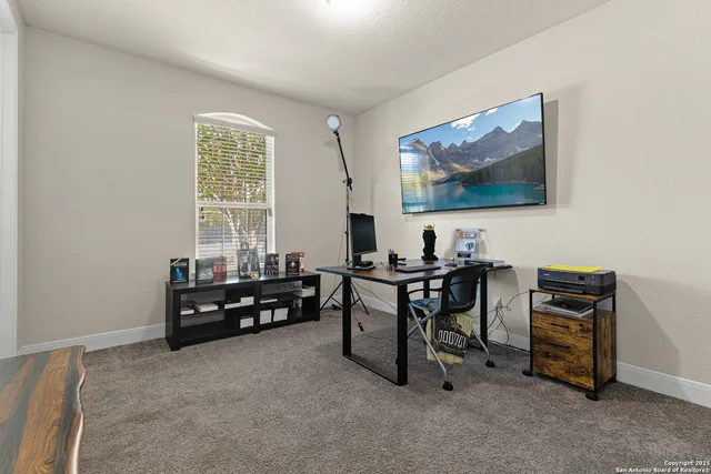 a view of a workspace with furniture