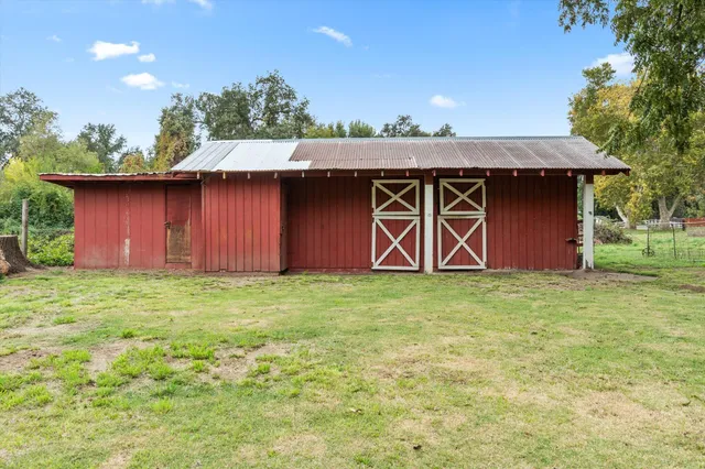 a backyard of a house with lots of green space