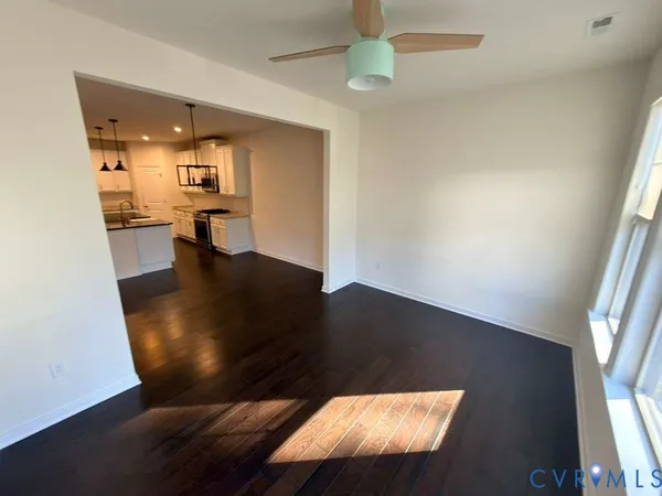 a living room with dining table