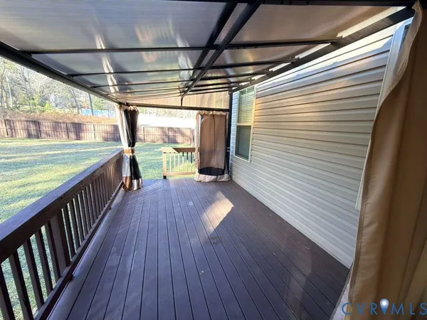 a view of a balcony with wooden floor