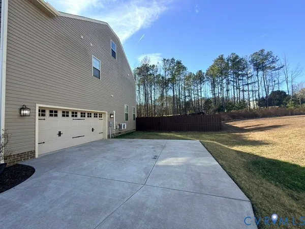 a view of backyard with outdoor space and trees