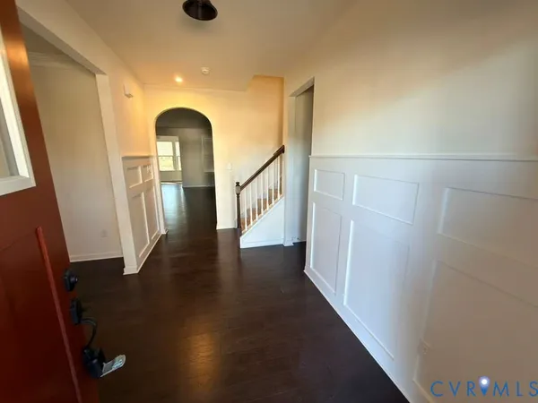 a view of entryway with wooden floor