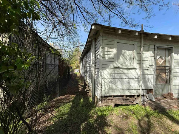 a view of backyard with a small cabin
