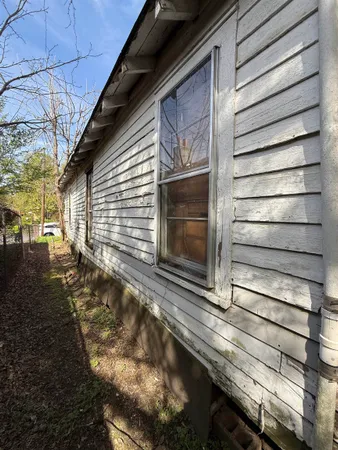 a view of backyard with a small cabin