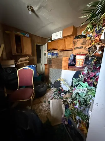 a room with lots of flowers and other items