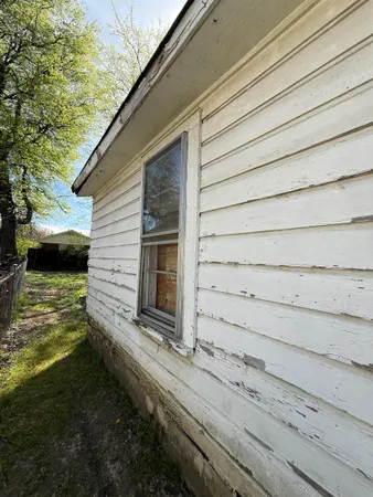 a view of house with backyard