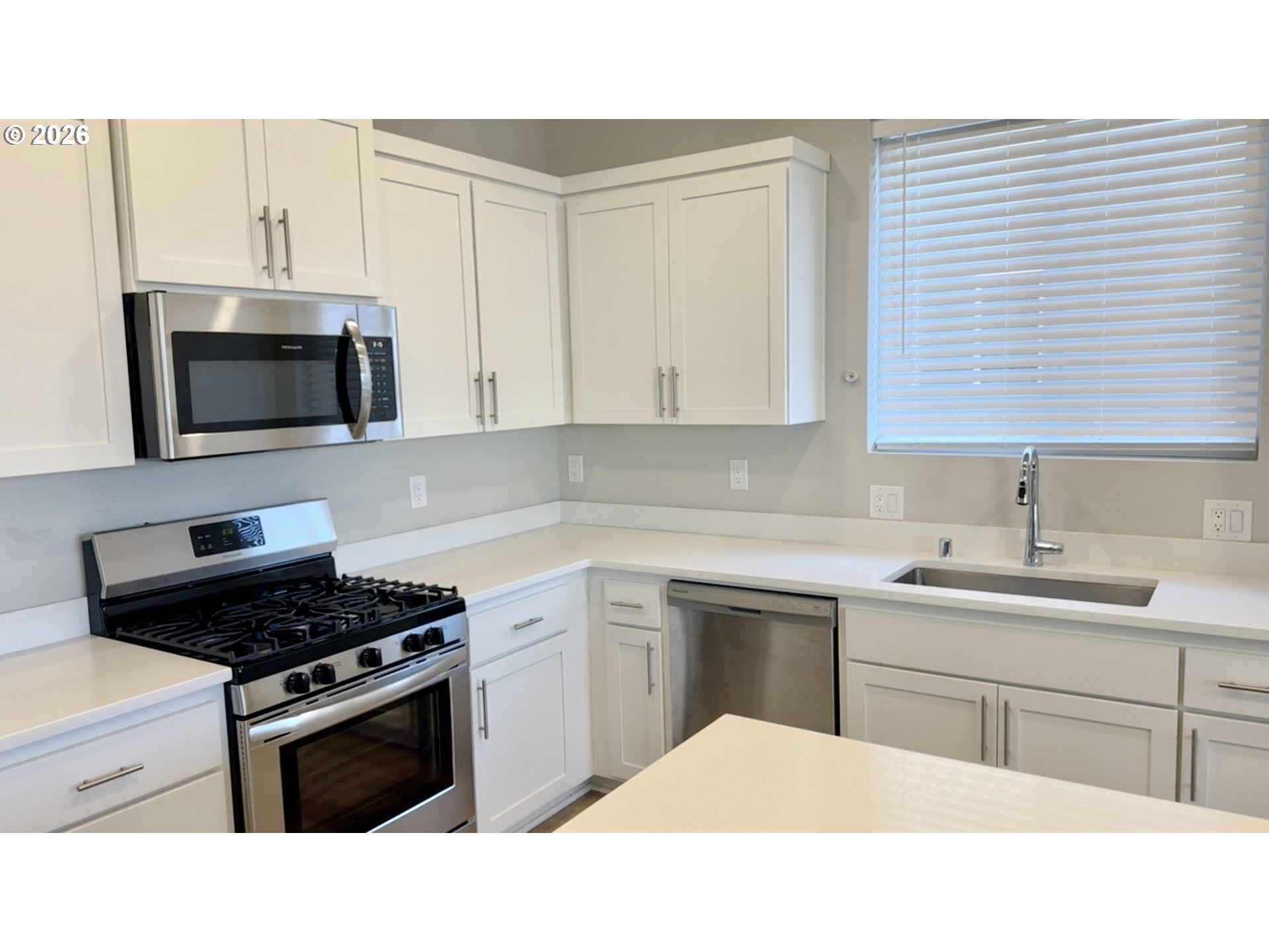 2011 Bethany Street Longview, WA 98632 - Photo 13 of 24 a kitchen with a sink stove and microwave