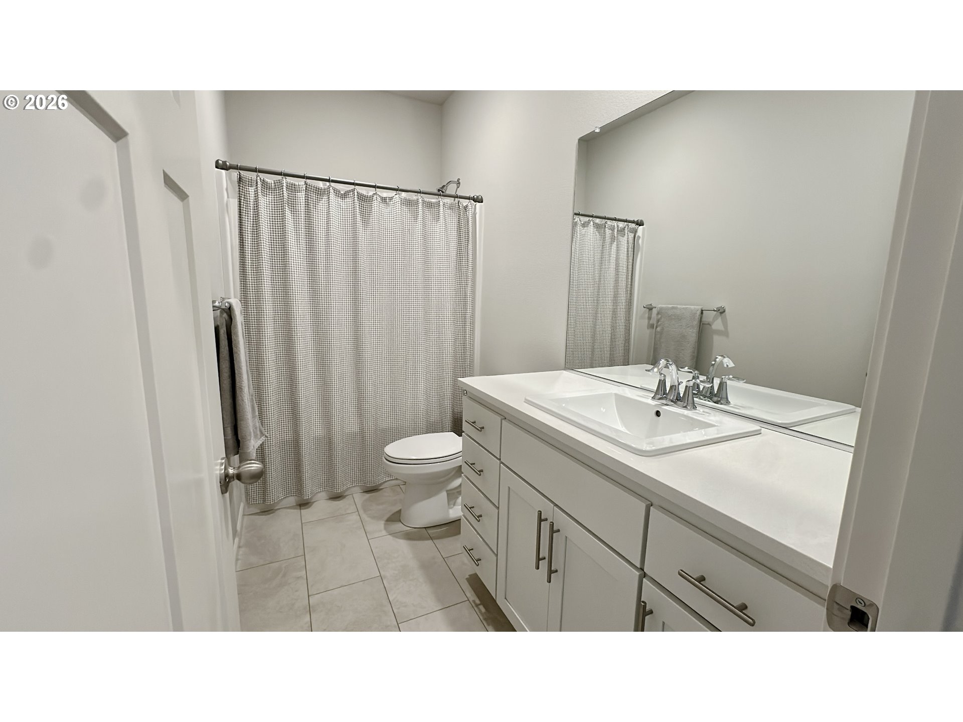 2011 Bethany Street Longview, WA 98632 - Photo 7 of 24 a bathroom with a sink a toilet a mirror and shower