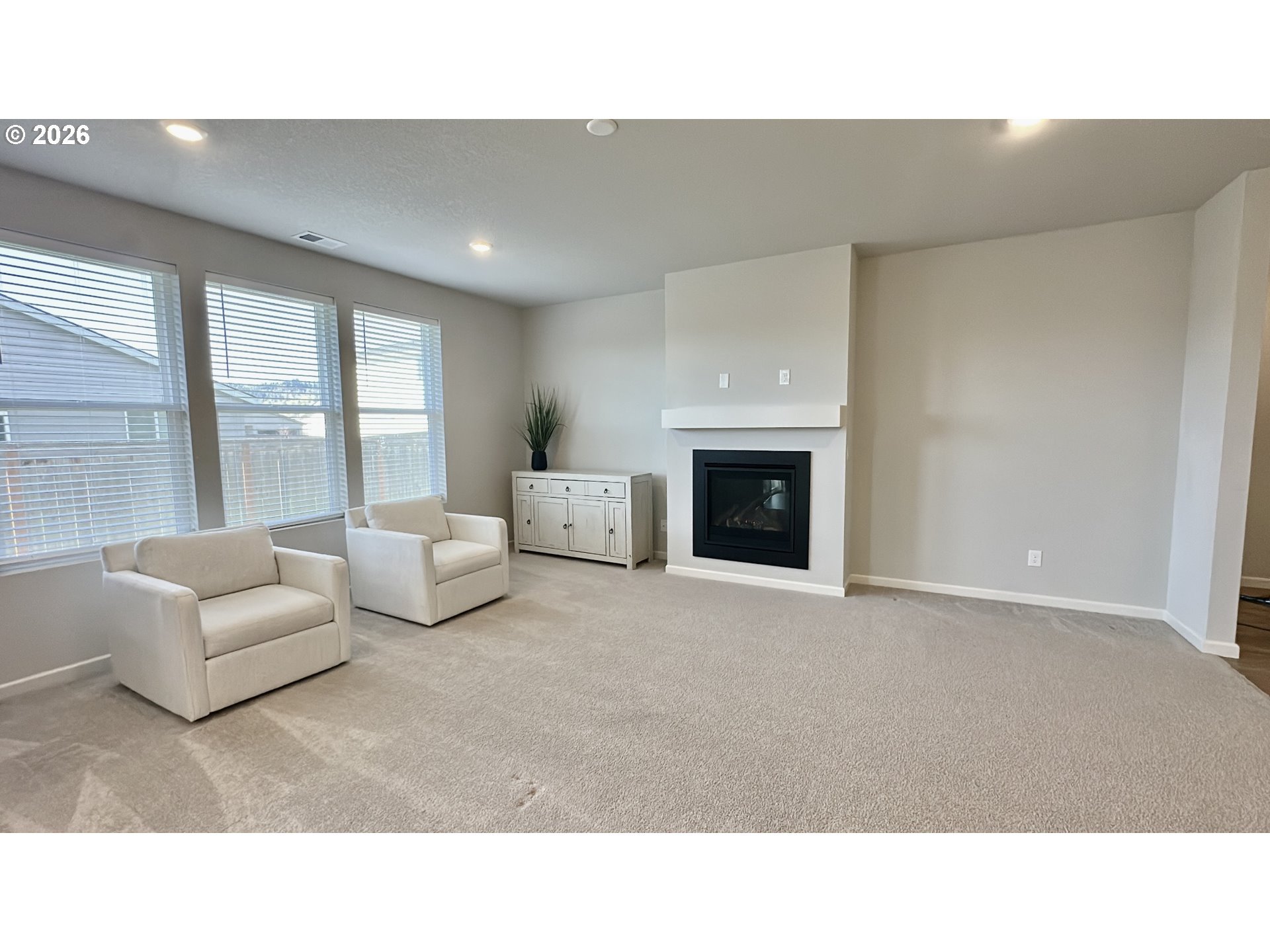 2011 Bethany Street Longview, WA 98632 - Photo 10 of 24 a living room with furniture and a fireplace