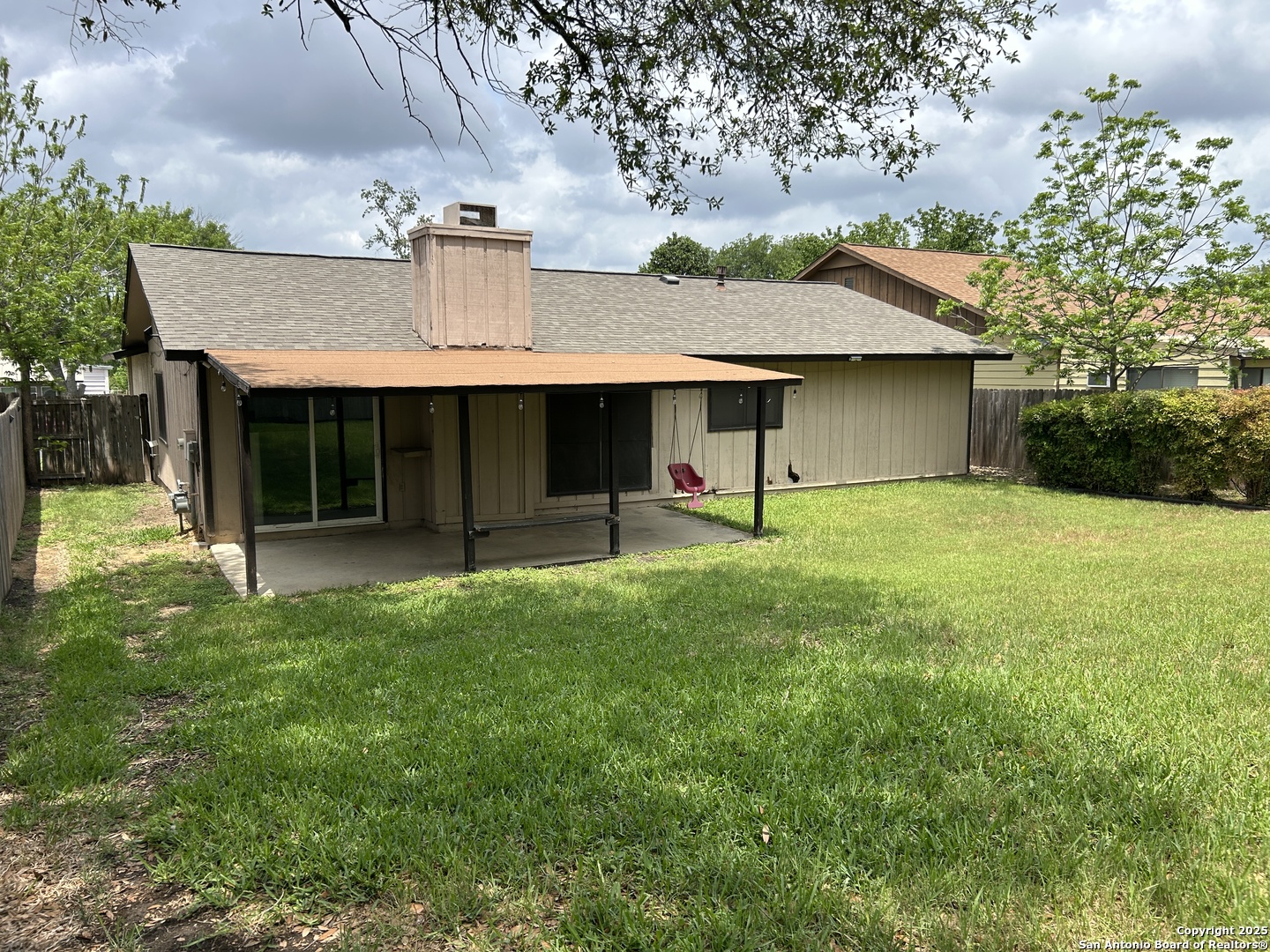 5938 Kissing Oak Street San Antonio, TX 78247 - Photo 11 of 11 a view of a house with pool and a yard