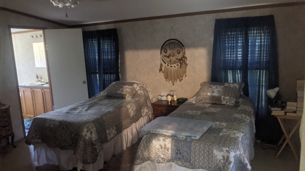 599 Little Fiery Road Sequatchie, TN 37374 - Photo 15 of 34 a bedroom with furniture and baby bed