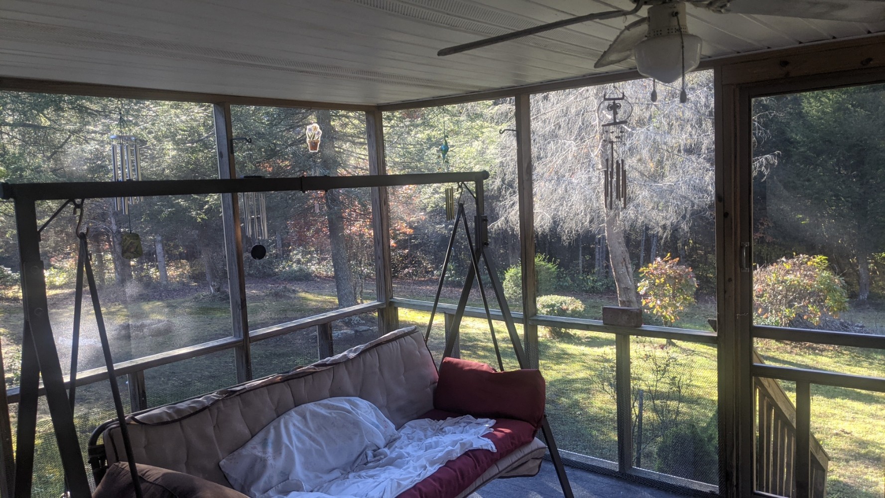 599 Little Fiery Road Sequatchie, TN 37374 - Photo 25 of 34 a living room with large glass windows and furniture