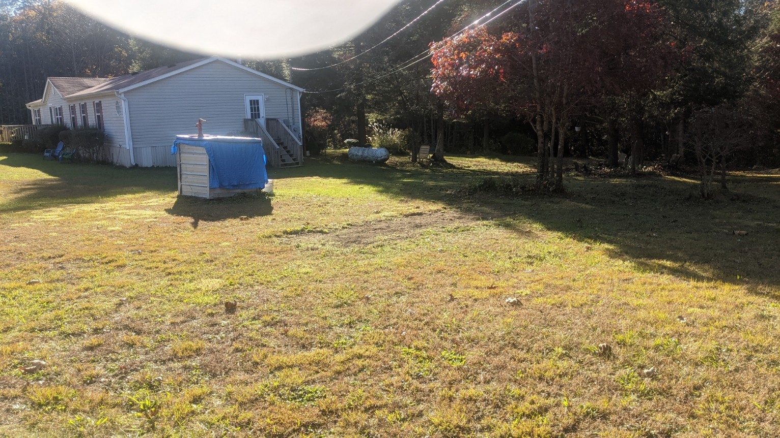 599 Little Fiery Road Sequatchie, TN 37374 - Photo 34 of 34 a backyard of a house with yard and outdoor seating