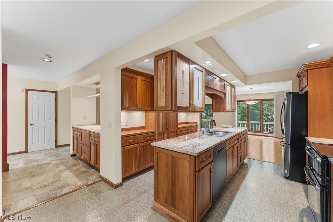 5741 Som Center Road, Unit 1 Solon, OH 44139 - Photo 21 of 50 Spacious kitchen featuring extensive wood cabinetry, granite countertops, and recessed lighting