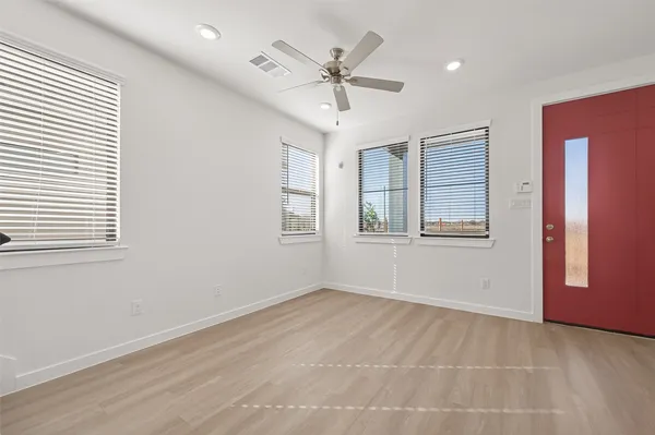 a view of an empty room with a window