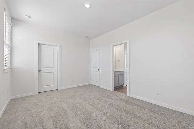 an empty room with closet area