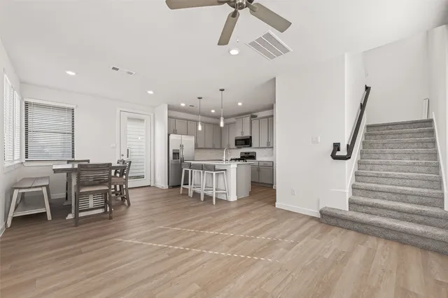 a view of kitchen with furniture and wooden floor