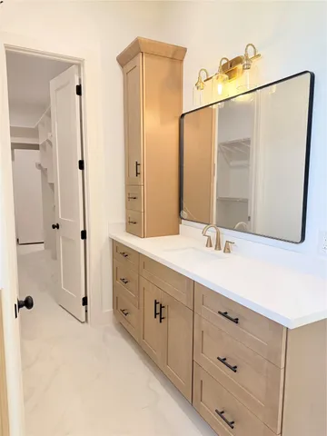 a bathroom with a double vanity sink mirror double and shower