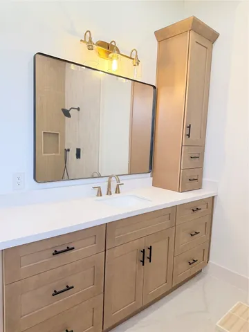 a bathroom with a double vanity sink and mirror