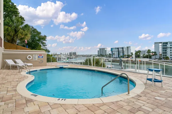 a view of a swimming pool and lounge chair