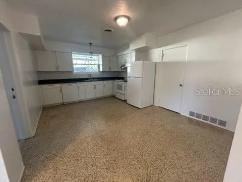 a view of empty room with windows