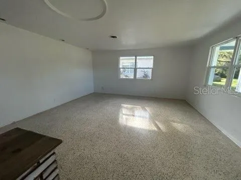 an empty room with windows